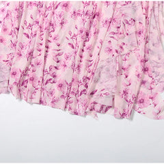 Pink floral patterned fabric on a white background