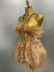 Side view of gold crystal wing mini dress