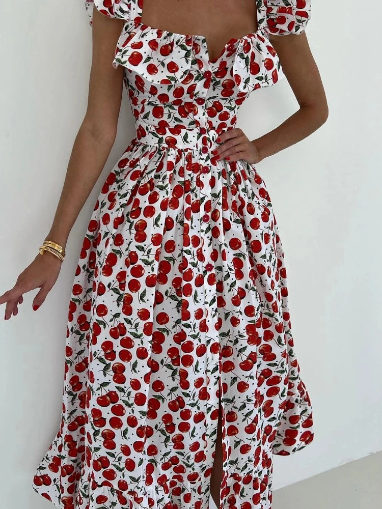 Woman wearing a red and white floral dress against a white background