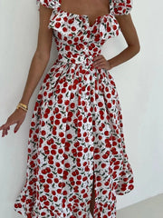 Woman wearing a red and white floral dress against a white background