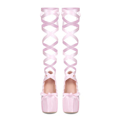 Pink high-heeled shoes with bow details and matching over-the-knee ribbons on a white background