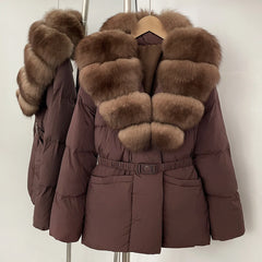 Brown puffer jacket with fur trim on a hanger against a white background