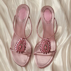 Pair of pink crystal embellished thin heel sandals.