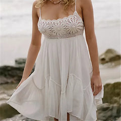 White crochet lace mini dress with spaghetti straps and ruffle hem