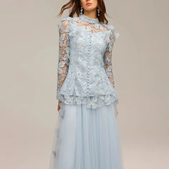 Light blue lace top and skirt set on a neutral background