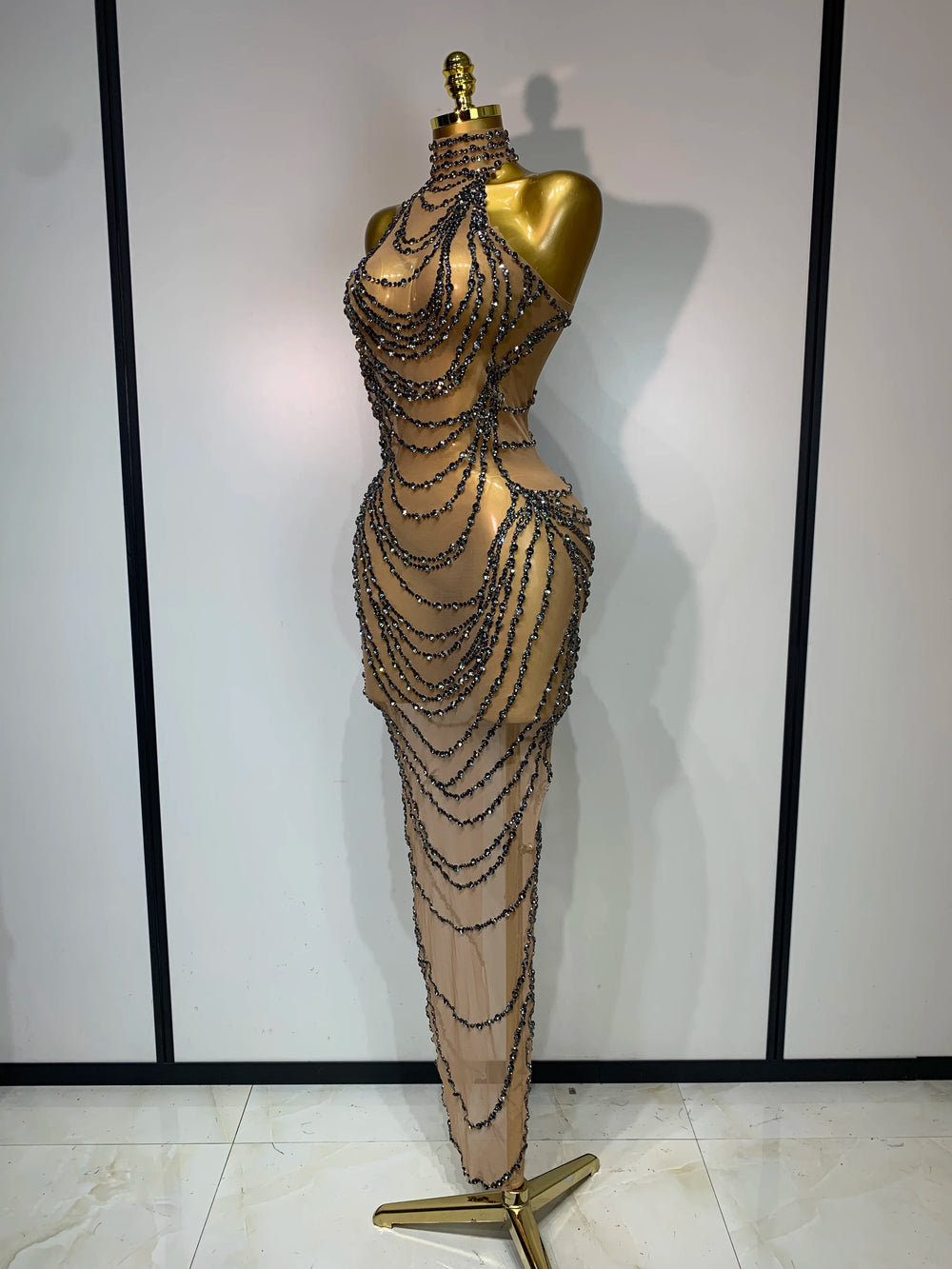 Side view of chain embellished halter gown