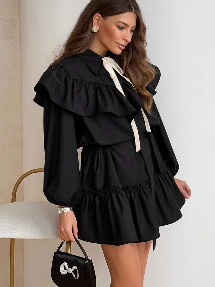 Black ruffled collar mini dress with bow tie and puff sleeves
