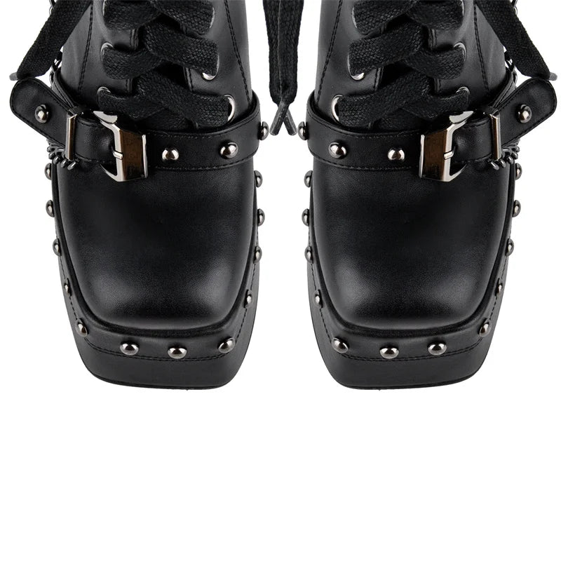 Front view of platform chunky heel ankle boots with studs
