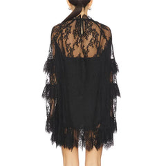 Black lace dress with sheer back on a white background