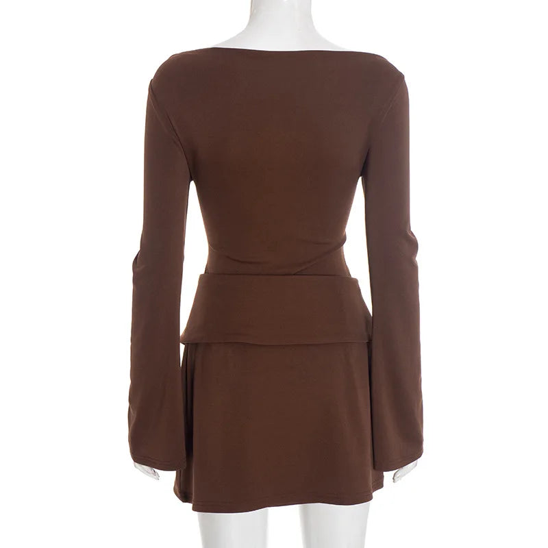 Brown dress on a mannequin against a white background