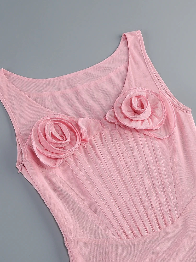 Pink dress with floral details on a gray background