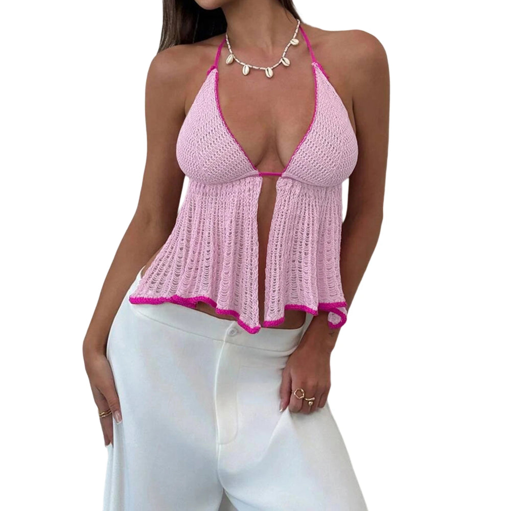 Woman wearing a pink crochet top and white pants on a white background
