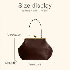 Brown handbag with size measurement labels on a beige background