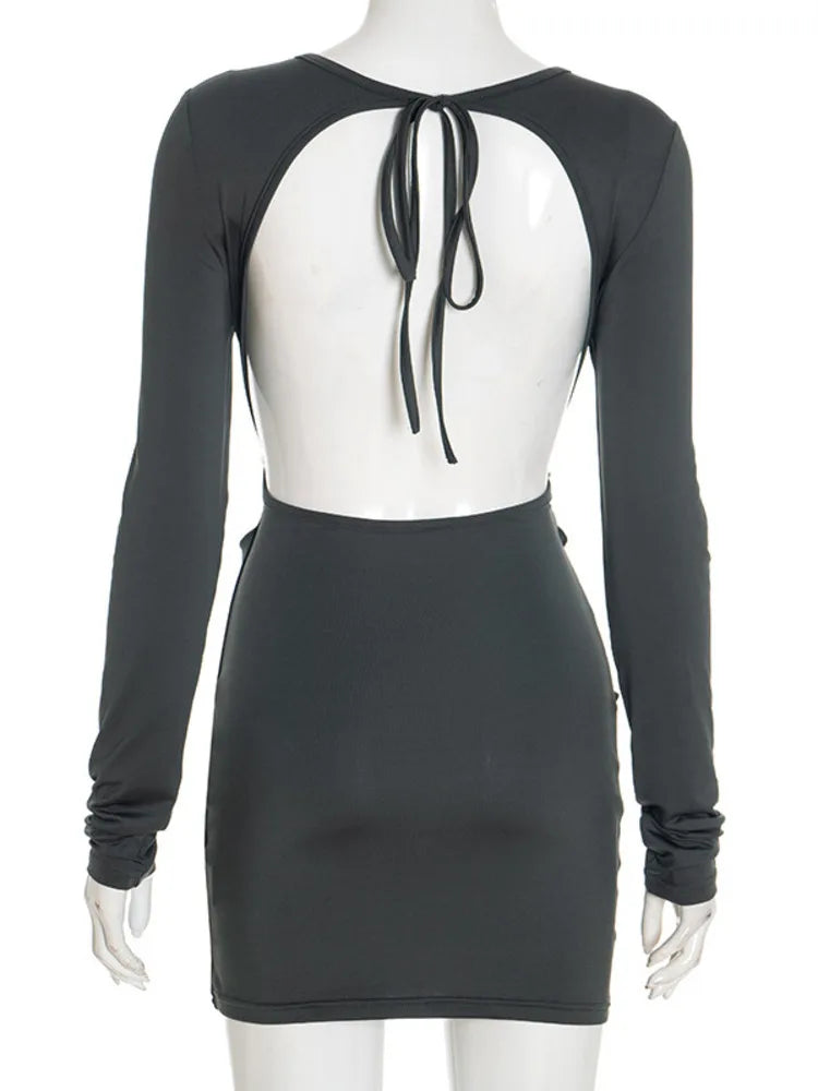 Black dress with sheer back on a mannequin against a white background