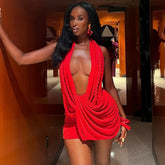 Woman in a red dress posing indoors