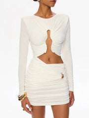 White long-sleeve dress with cut-out design on a white background