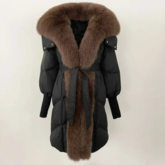 Black winter coat with brown fur collar and trim on a white background