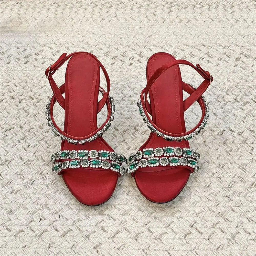 Top view of red crystal embellished stiletto sandals
