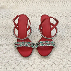 Top view of red crystal embellished stiletto sandals