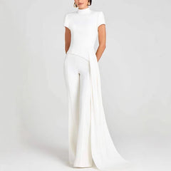 Person wearing a white outfit on a plain background