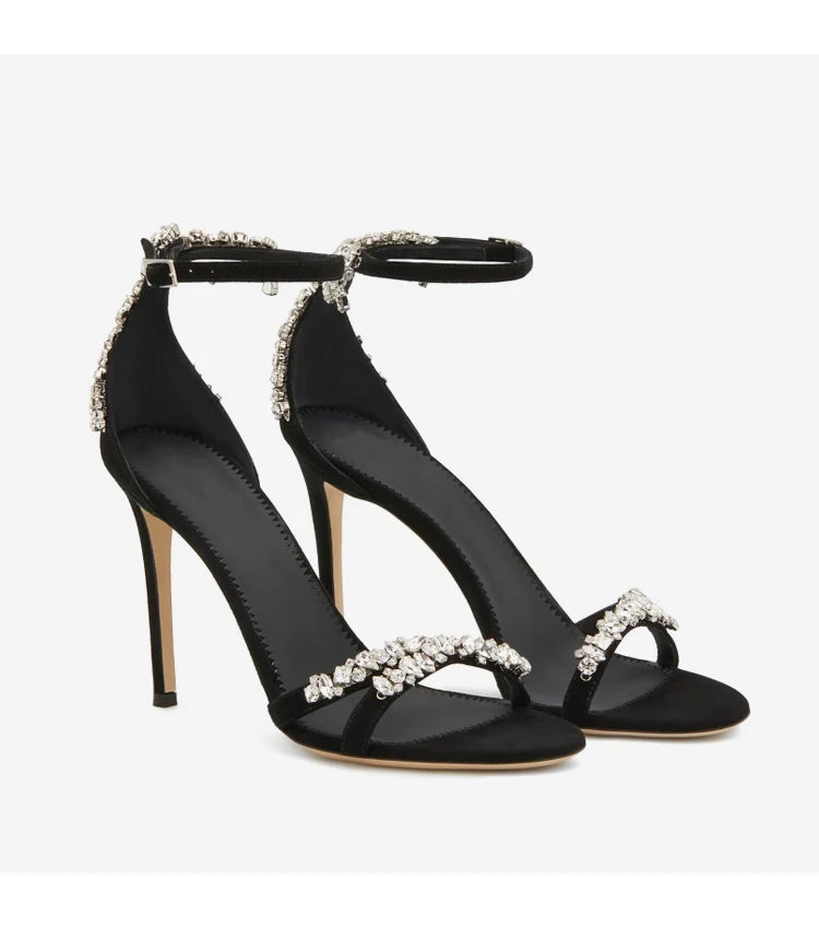 Black embellished stiletto heels with ankle strap