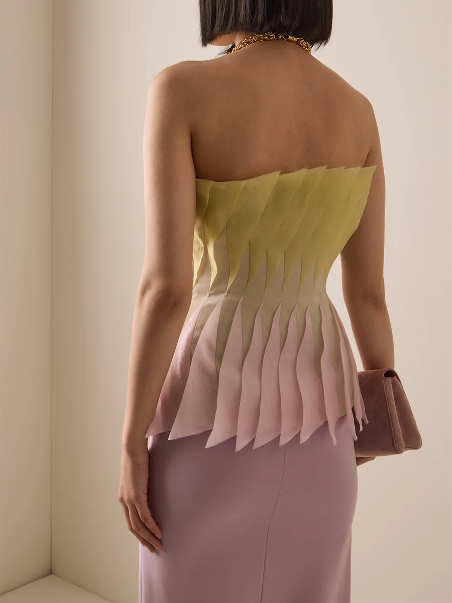 Back view of pleated peplum strapless top
