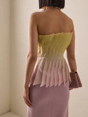 Back view of pleated peplum strapless top