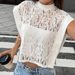 Lace mock neck sleeveless sheer crop top worn by a person holding a coffee cup.