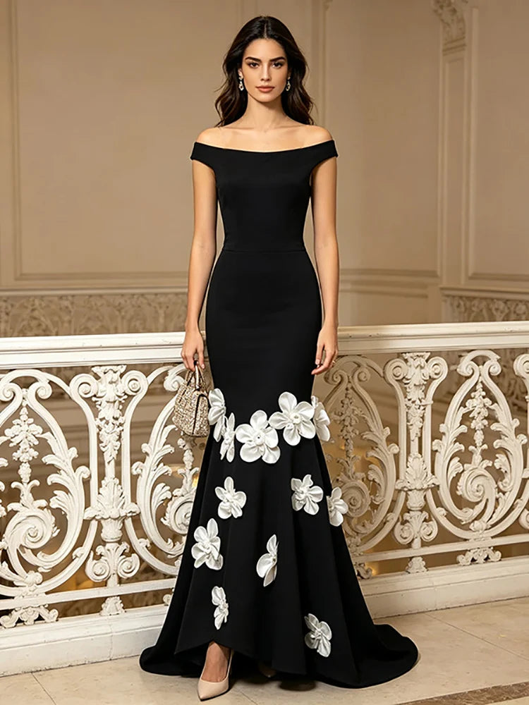 Black off-shoulder maxi dress with 3D floral appliqués