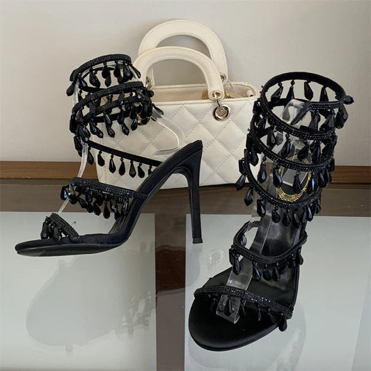 Black crystal ankle strap stiletto heels with handbag