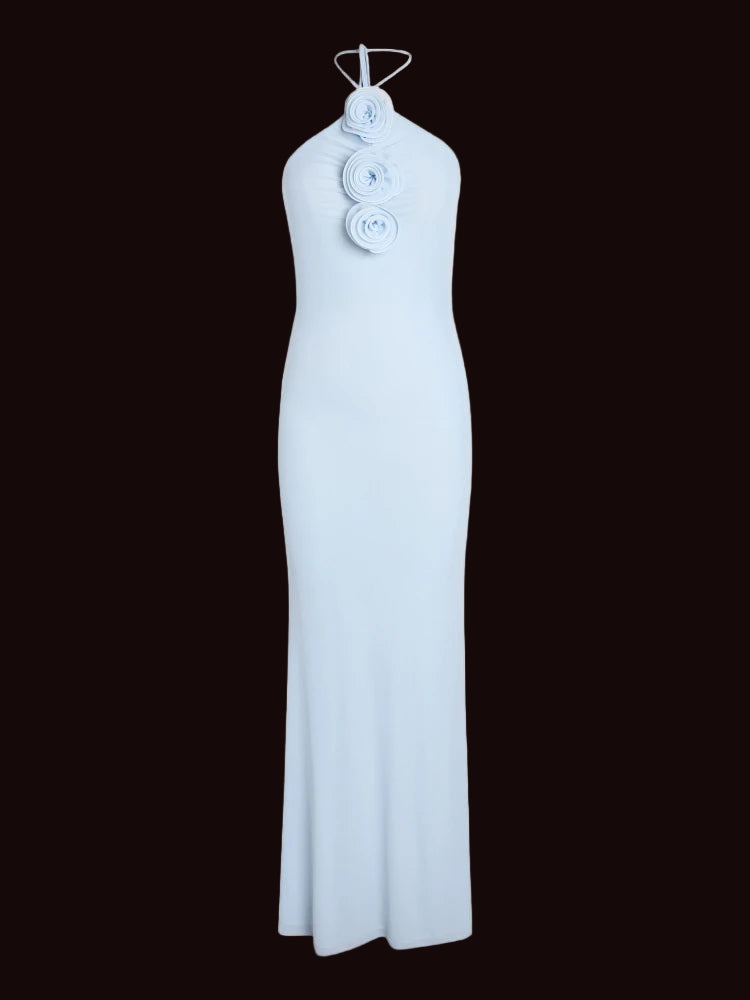 Light blue halter neck dress with floral details on a white background