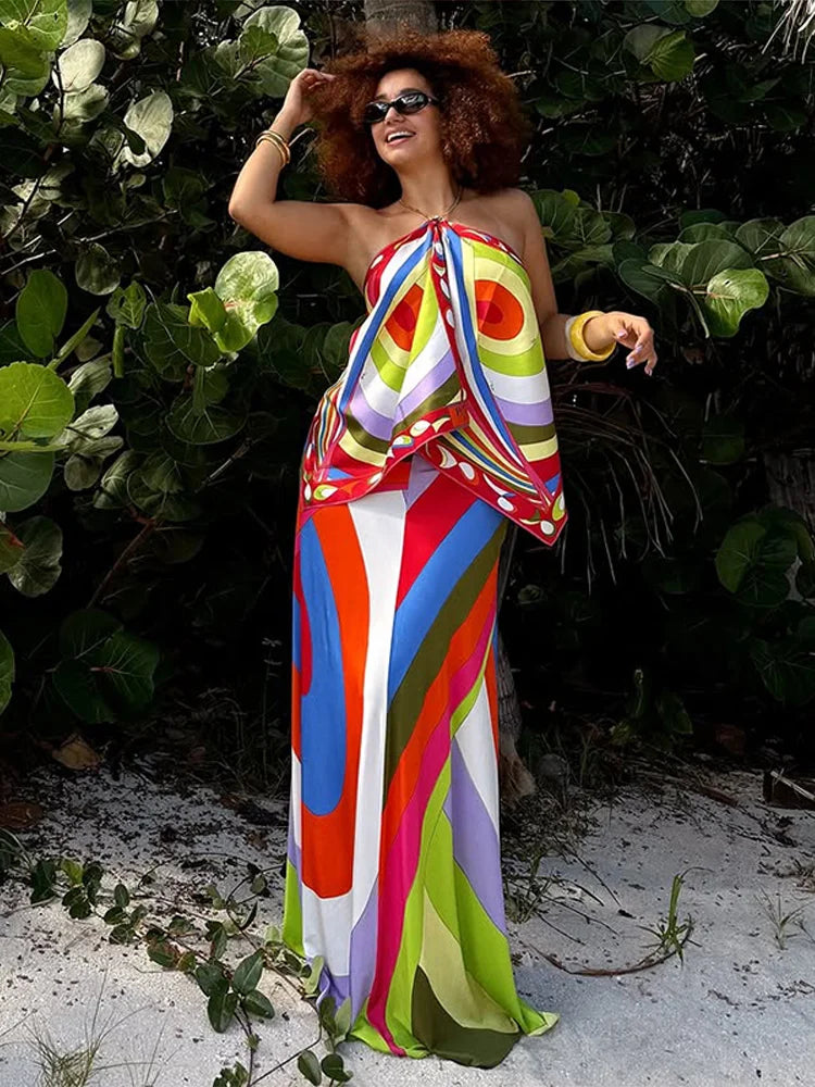 Model wearing a full psychedelic print maxi dress.