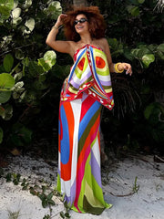 Model wearing a full psychedelic print maxi dress.
