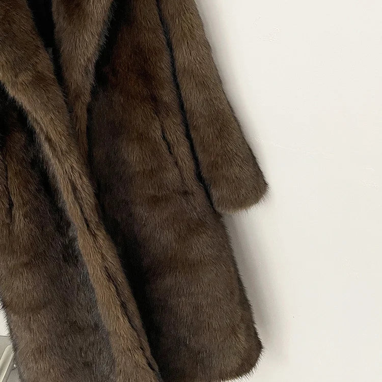 Brown fur coat on a white background
