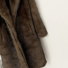 Brown fur coat on a white background