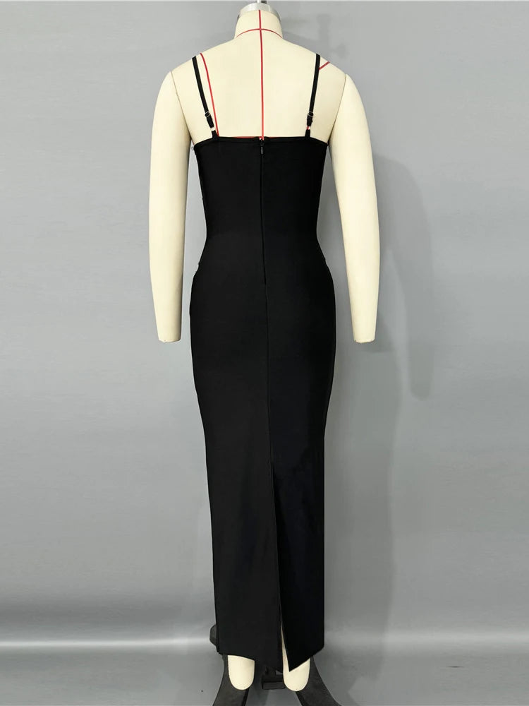 Black dress on a mannequin against a gray background