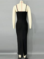 Black dress on a mannequin against a gray background