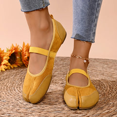Yellow split toe ballet flats on foot