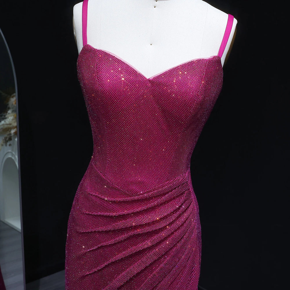 Purple sparkly dress on a mannequin against a black background