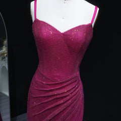 Purple sparkly dress on a mannequin against a black background