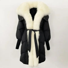 Black winter coat with a large white fur collar on a light gray background