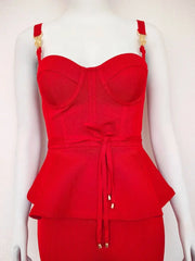 Red peplum top on a mannequin against a white background