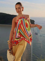 Psychedelic print halter top and wide-leg pants set on a model.