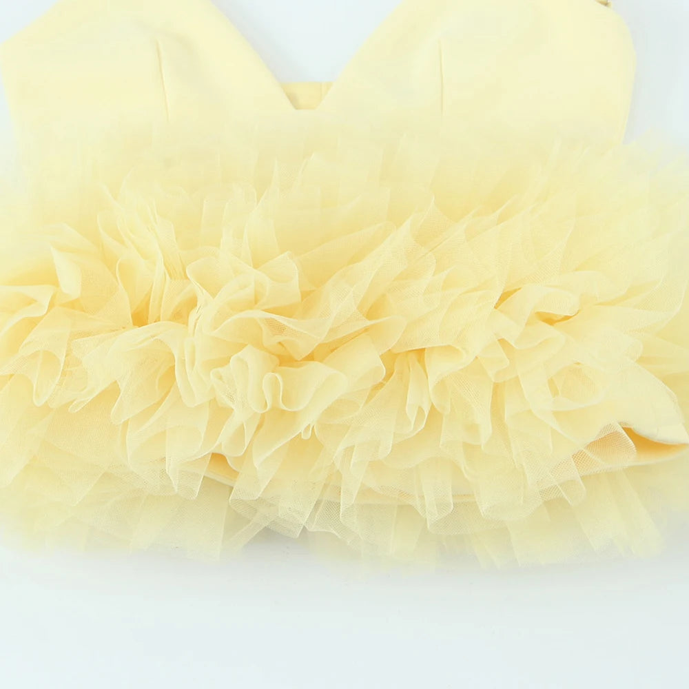 Close-up of light yellow tulle fabric on a white background