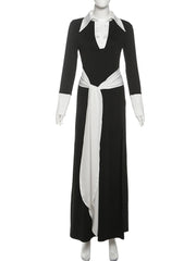 Black dress with white accents on a mannequin against a white background
