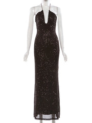Black sequin evening gown on a mannequin against a white background