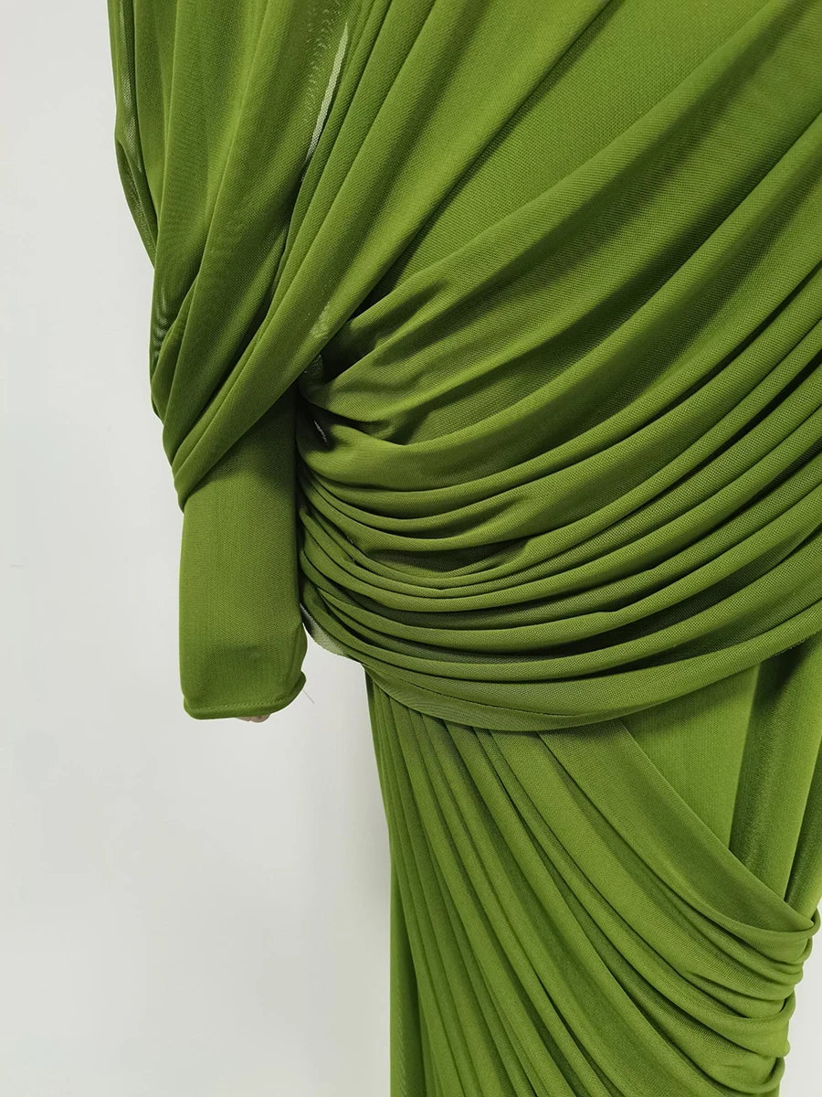 Green pleated fabric on a white background