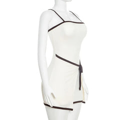 White dress with black accents on a mannequin against a white background