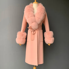 Pink coat with fur trim on a mannequin against a gray background