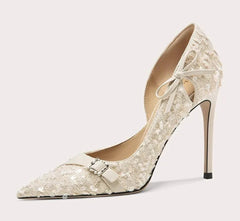 High-heeled shoe with lace design on a light gray background